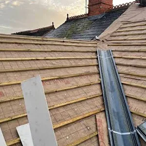 the roof of a house that has been gutted